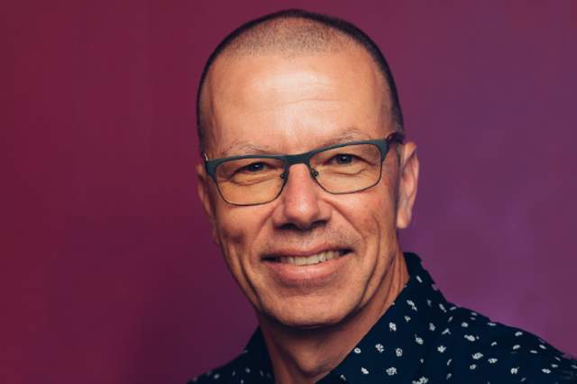 Smiling man wearing glasses