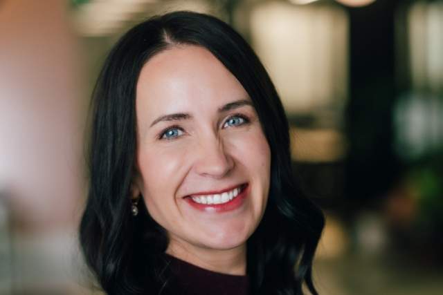 Smiling woman in maroon sweater