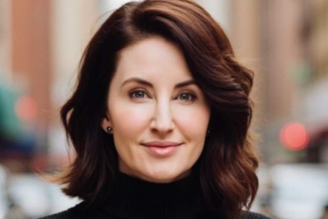 Smiling woman in black turtleneck