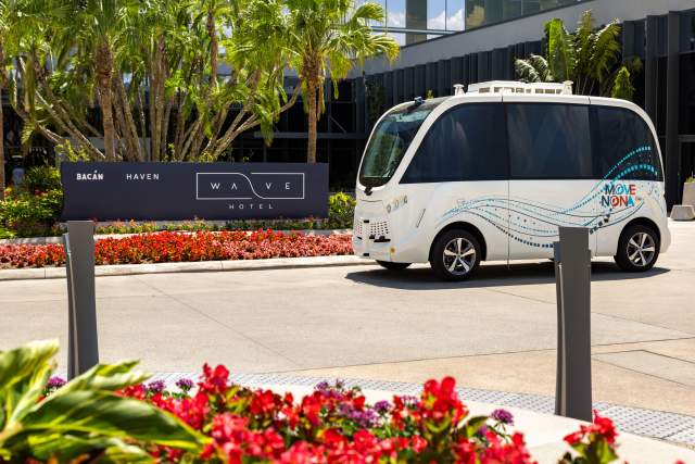 Lake Nona Wave Hotel beep shuttle outside hotel