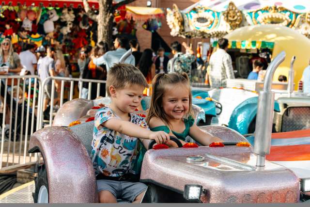 Children at Grapefest enjoying a festival ride