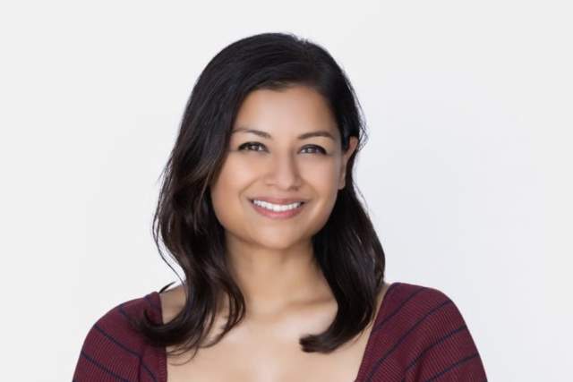Smiling woman in burgandy dress
