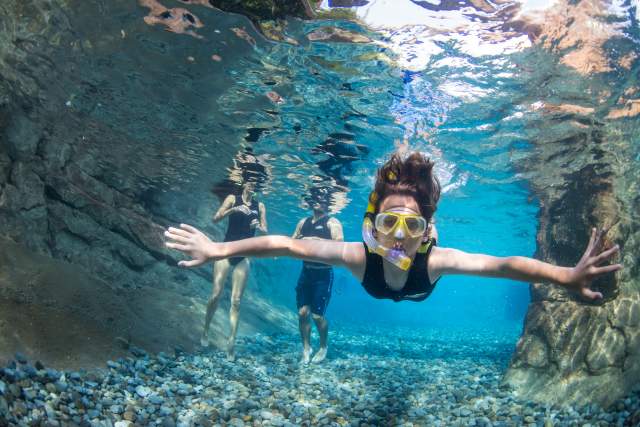 A woman snorkeling at Discovery Cove Wind-Away River