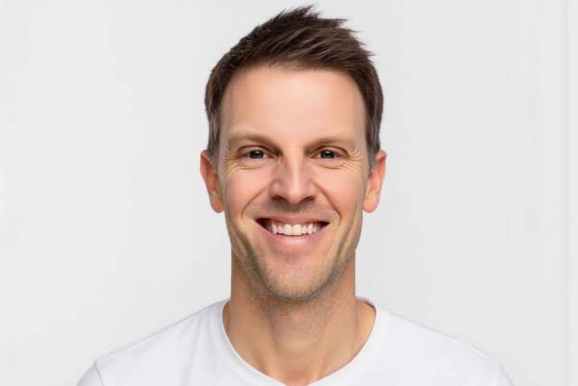 Smiling man in white t-shirt