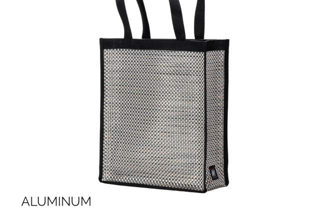 Black mesh tote bag with aluminum design accents, featuring dual straps and a tag on the side.