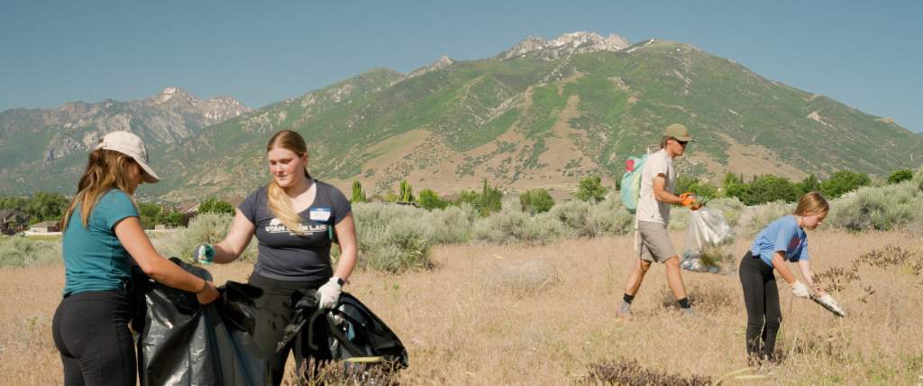 Volunteers clear out invasive weeds at the Leave it Loved event.