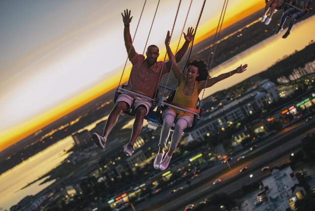 A couple riding the Orlando Starflyer at ICON Park