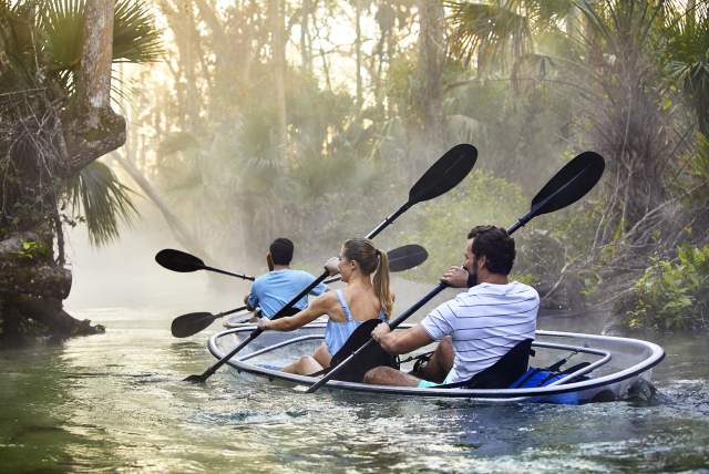 Couple kayaking through Kings Landing at Wekiva River