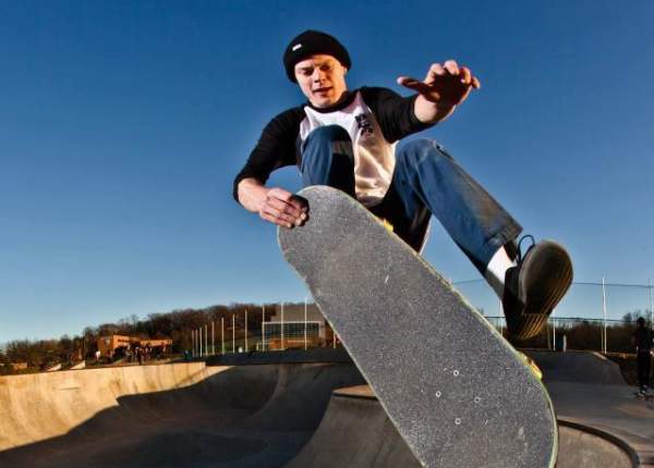 Young man performing skateboarding trick