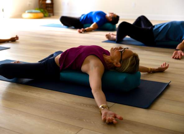 A relaxed woman doing a yoga pose in Sonoma