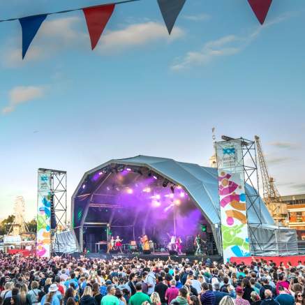 A view of the crowd in front of a stage at Bristol Harbour Festival - credit Paul Box