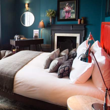 A luxury bedroom at Hotel Du Vin Avon Gorge with a large window and freestanding baths - Credit Amy Murrell