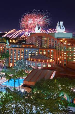 Night resort overview with fireworks of Walt Disney World Swan and Dolphin Resort