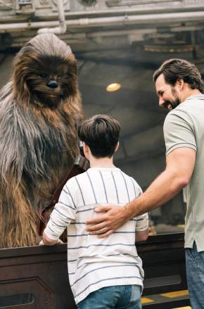 Kids meeting Chewbacca in Star Wars: Galaxy's Edge at Disney's Hollywood Studios in the Walt Disney World Resort.