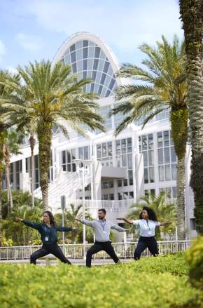 Meeting Planners doing yoga outside of the Orange County Convention Center