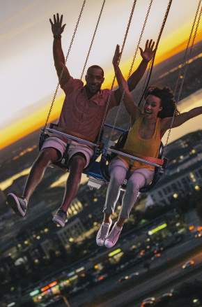 A couple riding the Orlando Starflyer at ICON Park