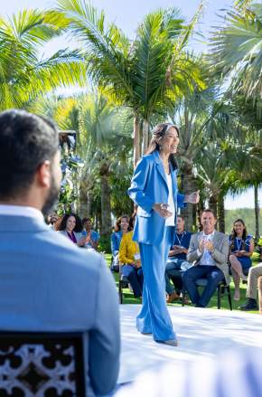 Keynote Speaker at an outdoor event in the sculpture garden at the Lake Nona Wave Hotel