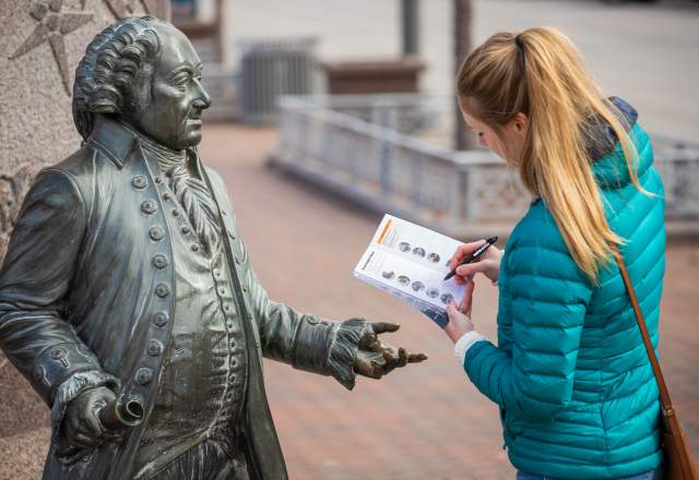 Woman filling out the City of Presidents Scavenger Hunt
