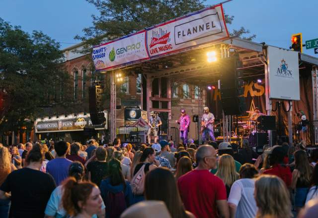 concert stage in the street in rapid city, sd with crowd  dancing to music