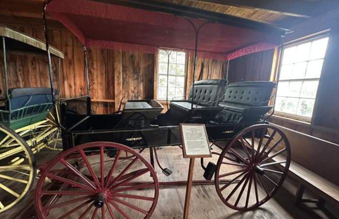 A spring wagon crafted between 1883 and 1920.