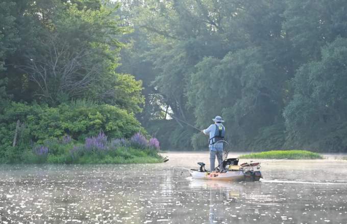 Kayak Fisherman on a creek.