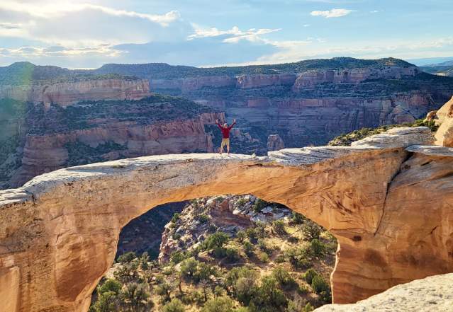 Man Standing on top of Rattlesnake Arches
