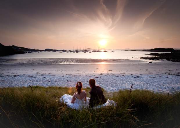 Wedding couple watching the sunset on St. Martin's