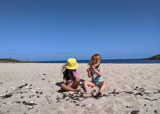 Two pre-schoolers on the beach