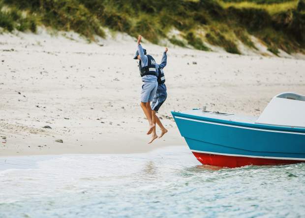 Kids jumping off boat