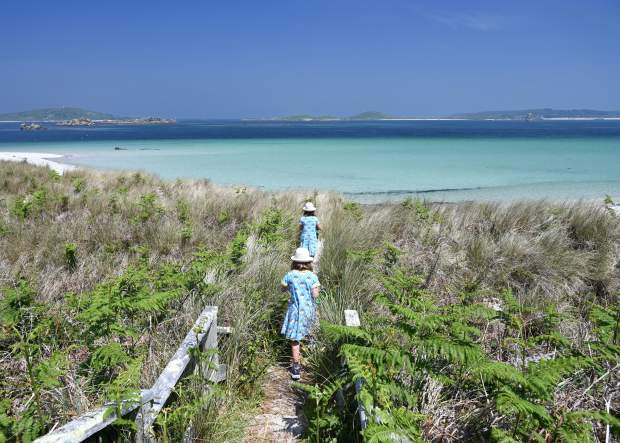 Girls walking to the beach