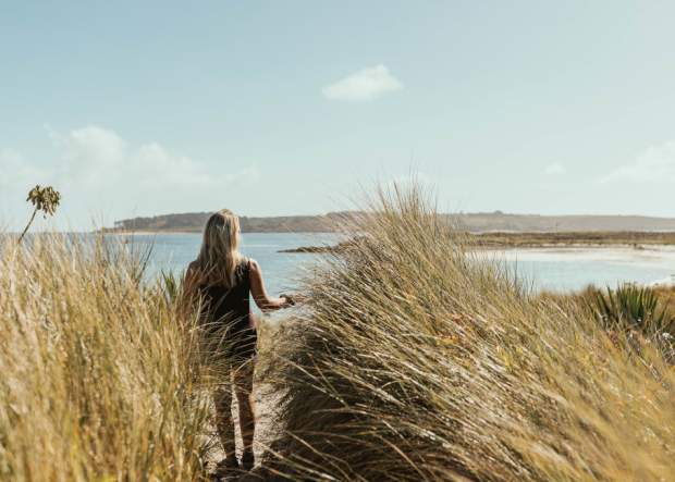 Girl on beach in autumn