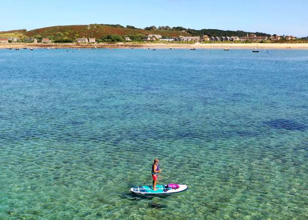 Woman on single paddleboard