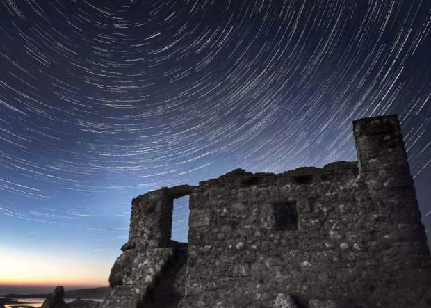 View of swirling stars over the Block House on Tresco
