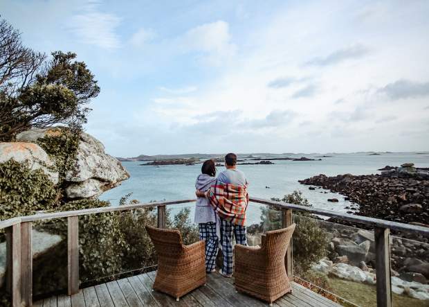 Couple hugging on Tresco balcony