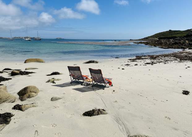 Two chairs on a beach