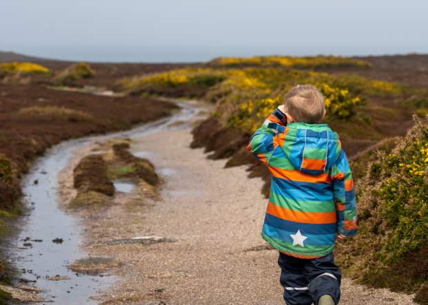 Boy walking in wet weather