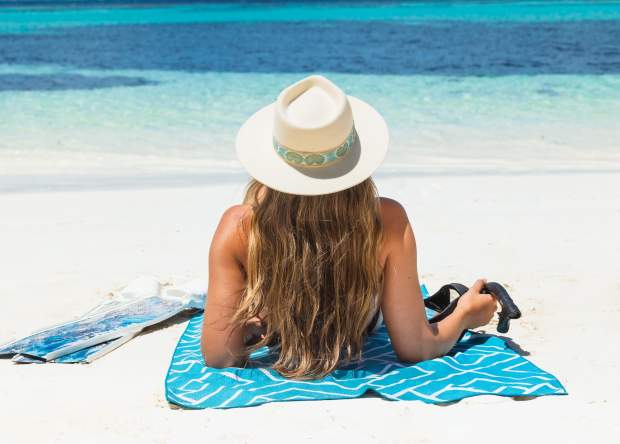 Girl on beach overlooking the ocean on Rottnest Island