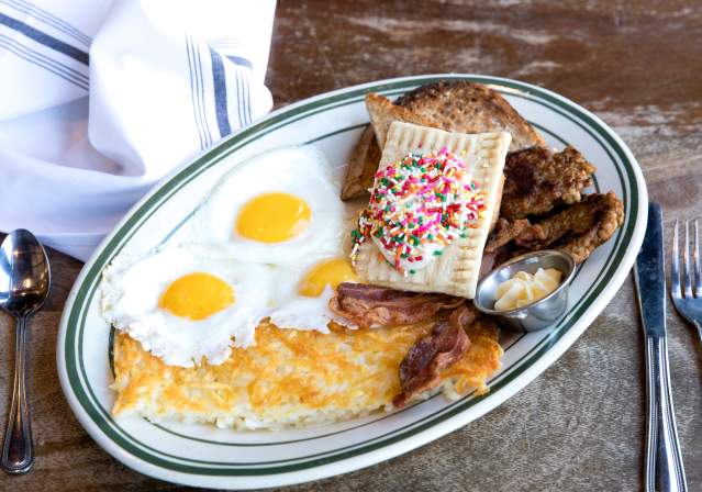 Ted's Bulletin breakfast spread featuring fried eggs, hash browns, bacon and homemade pop tarts