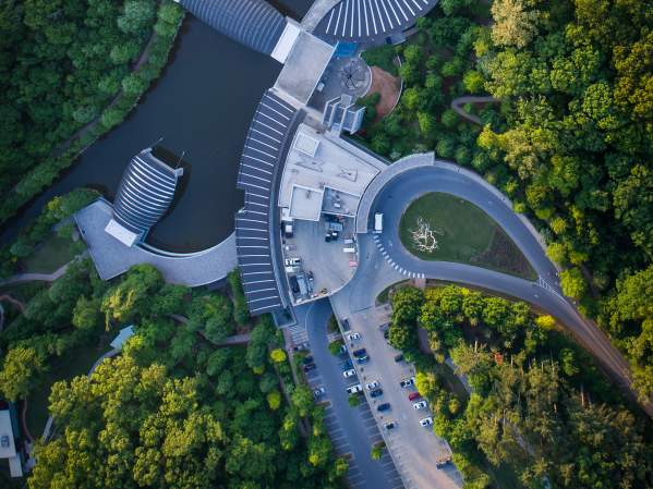 Aerial view of Crystal Bridges Museum of American Art surrounded by bright green trees