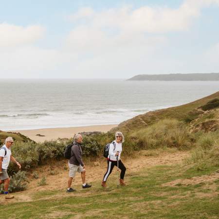 3 walkers in sand dunes