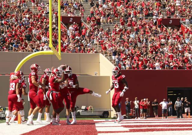 Hoosiers celebrating a touchdown on the field