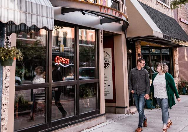 Couple walking in Downtown Oshkosh