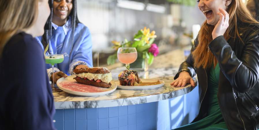 Group of Women enjoying food at Blume Restaurant in Greater Wilmington, Delaware