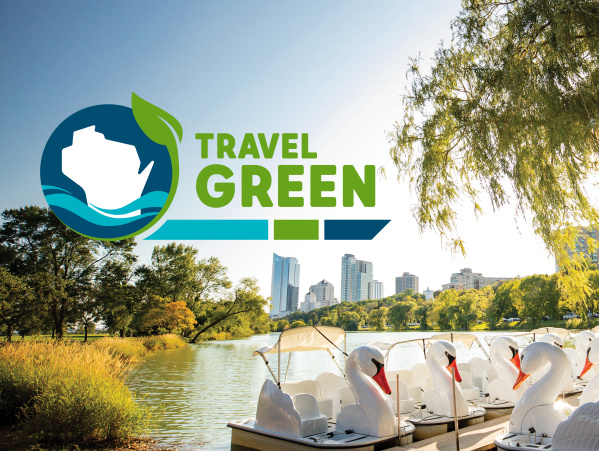 Travel Green Logo over a photo of Veterans Park Lagoon
