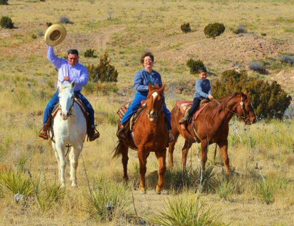 Family riding horses at Cowgirls and Cowboys in the West