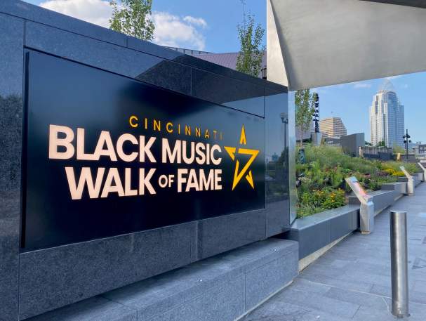A black marble sign that says Cincinnati Black Music Walk of Fame