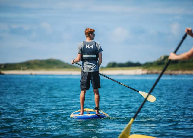 Paddleboarding teenagers
