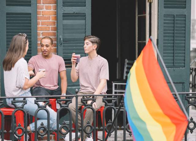 LGBTQ Friends Having Drinks on a French Quarter Balcony