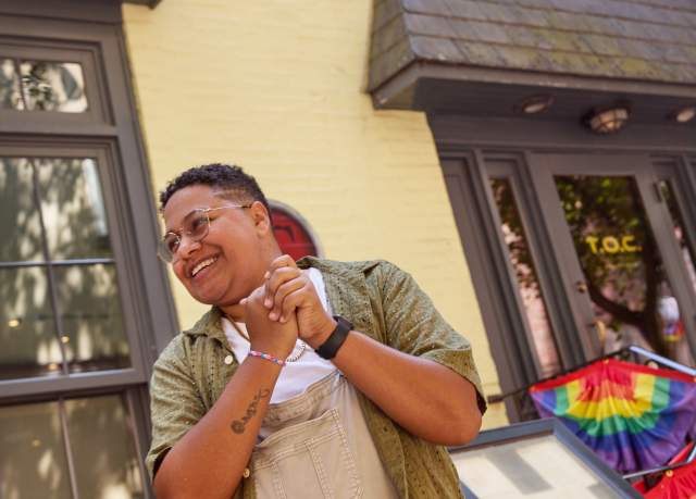 A person laughs outside of the oldest gay bar in Philadelphia, Tavern on Camac.