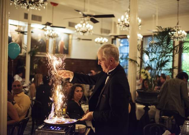 An Arnaud's employee sets fire to a pan to make café brulot